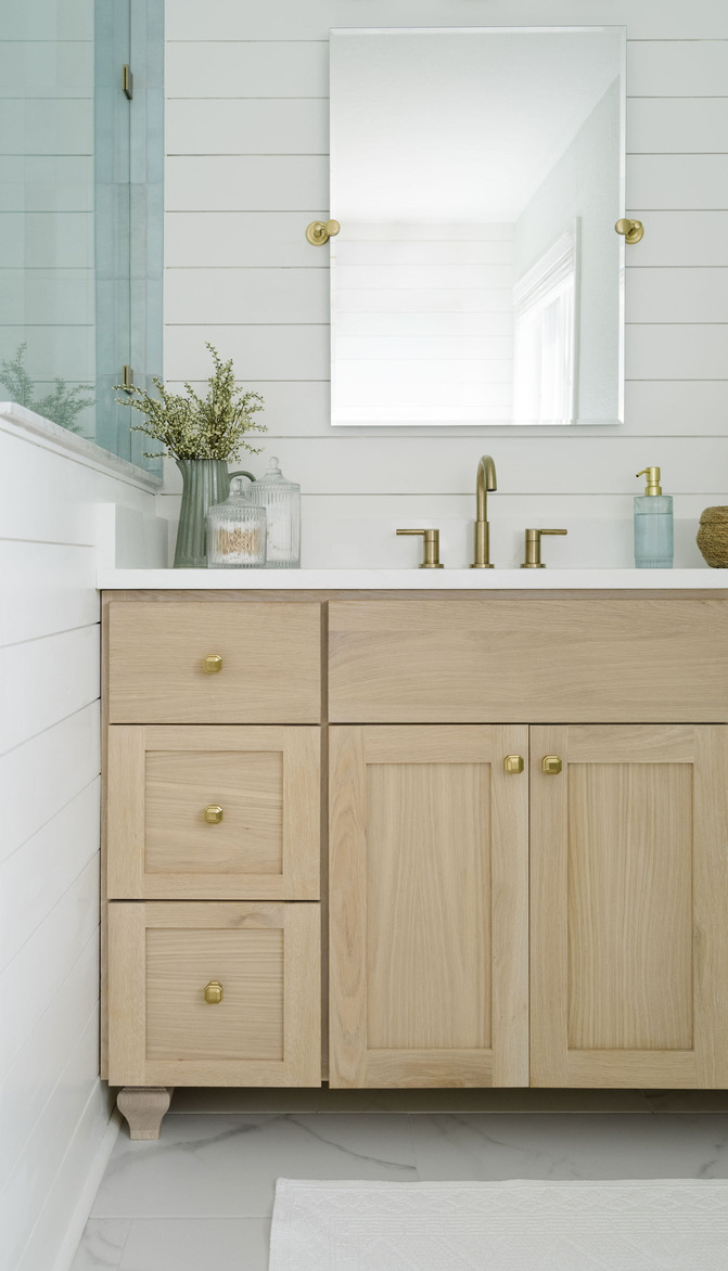 baby blue cloe tile bedrosians shower with delta champange bronze shower fixtures cape charles virginina bay creek bathroom renovation design white oak vanity with shiplap walls white snow sherwin williams kingston blue custom vanity honey bronze top knobs hardware