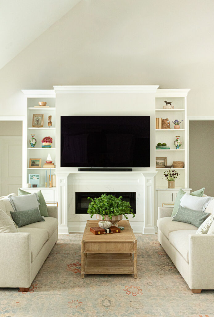 Custom fireplace wall with built-in cabinetry in Bay Creek Cape Charles home